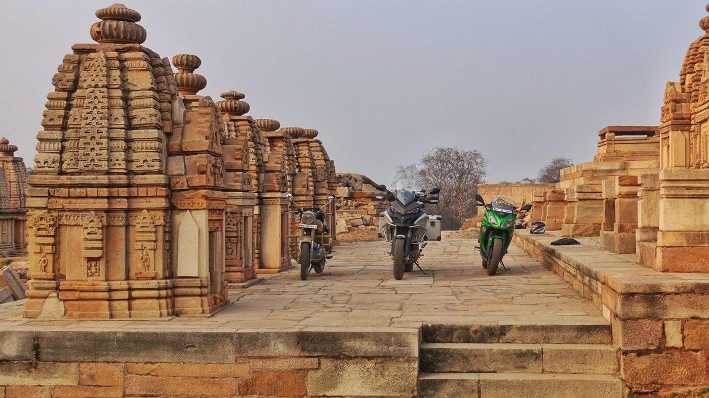 Motorcycles photographed at a historic site near Gwalior